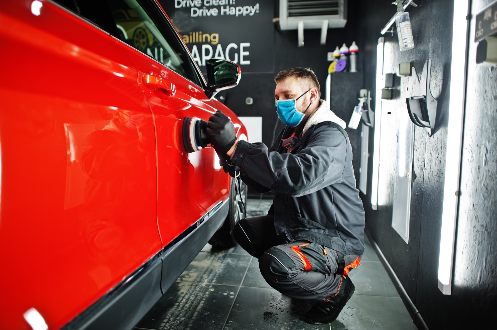 Hail-damaged vehicle being inspected at 1Stop Dent Repair